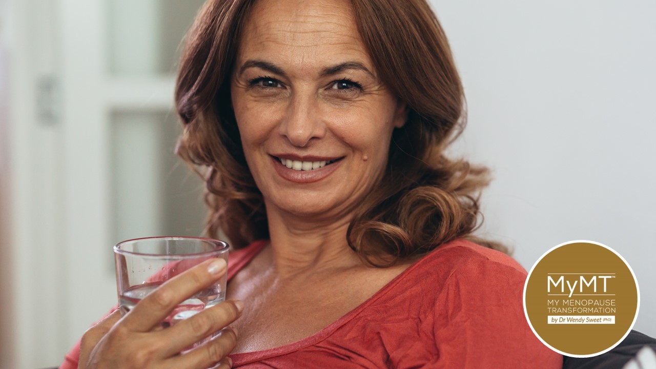Woman Holding Glass of Water