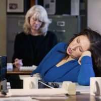 Tired looking woman at work